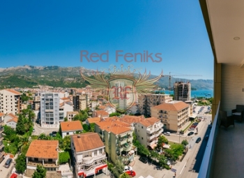 A spacious stylish apartment for sale of 89 m2 is located in a new house in Budva, 100 meters from the sea.