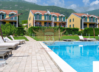 For sale A wonderful, three-storey townhouse with 4 bedrooms in a gated, beautiful village with swimming pools in the suburbs of Budva - an ideal place for permanent family residence.