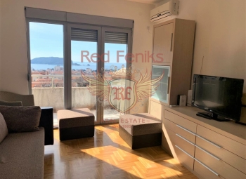 Apartments in a modern house in the center of tourist life in Montenegro, the city of Budva.
