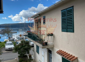 Your seaside sanctuary awaits in Tivat! Just 10 meters from the shimmering sea, this semi-detached house offers an unparalleled coastal lifestyle.