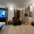For sale small one bedroom flat in an old house in Rafailovici on the first floor.