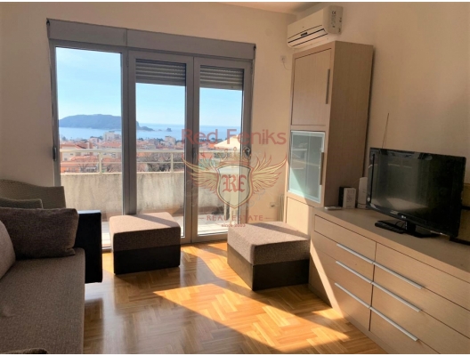 Apartments in a modern house in the center of tourist life in Montenegro, the city of Budva.